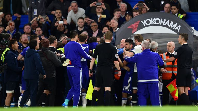 A altercation takes place after the final whistle between Chelsea and Tottenham players and coaching staff