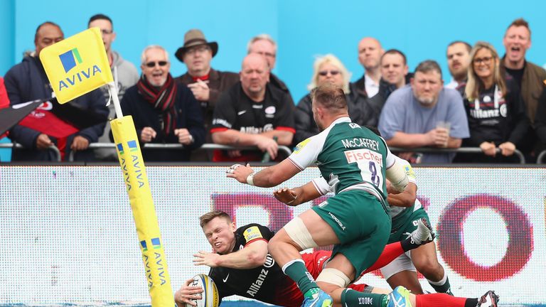 Chris Ashton of Saracens goes over the line to score a try during the Aviva Premiership semi-final between Saracens and Leicester