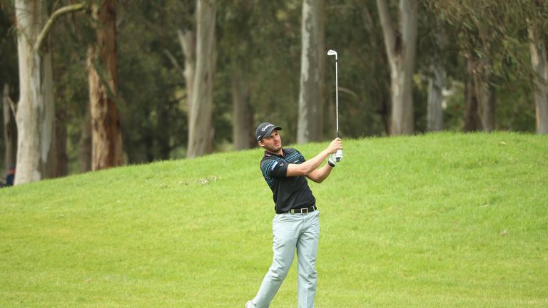 Chris Hanson of England plays his second shot on the 18th hole during the third round of the Trophee Hassan II at Royal Golf Dar 