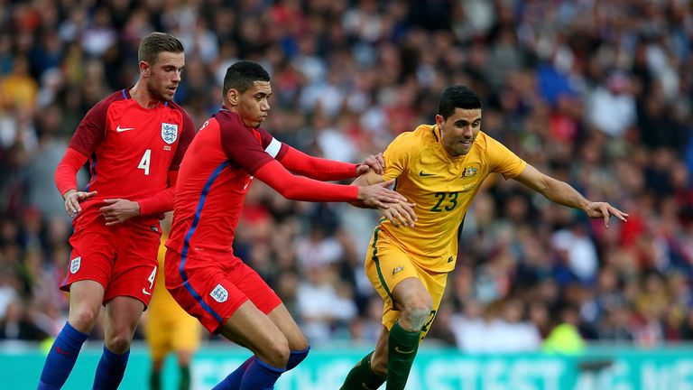 SUNDERLAND, ENGLAND - MAY 27:  Tom Rogic of Australia holds off pressure from Chris Smalling of England during the International Friendly match between Eng