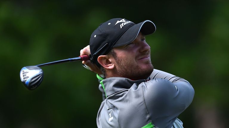 Chris Wood watches his tee shot on the 8th hole during the fourth day of the golf PGA Championship at Wentworth Golf Club