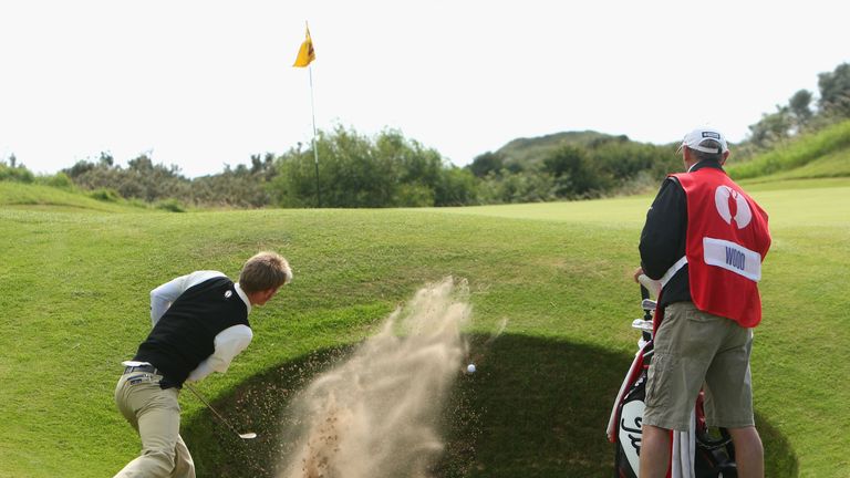 Amateur Chris Wood of England plays out of a greenside bunker on the 12th during the final round of the 137th Open Ch