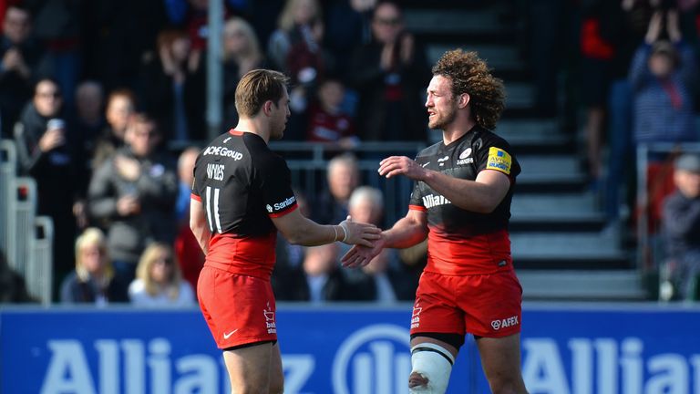 Chris Wyles of Saracens shakes the hand of Jacques Burger as the Namibian walks off in his last match