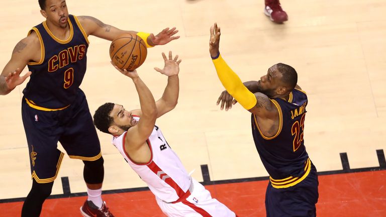 Cory Joseph #6 of the Toronto Raptors shoots against LeBron James #23 of the Cleveland Cavaliers in the second half in game four of t