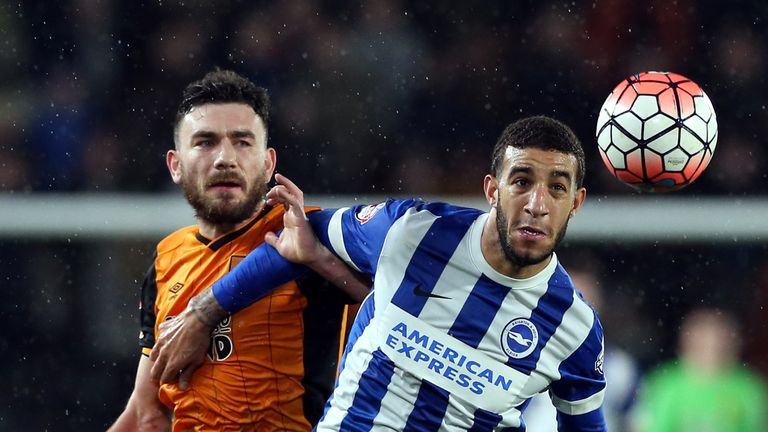 HULL, ENGLAND - JANUARY 09:  Robert Snodgrass of Hull City (L) challenges Connor Goldson of Brighton & Hove Albion during The Emirates FA Cup Third Round m