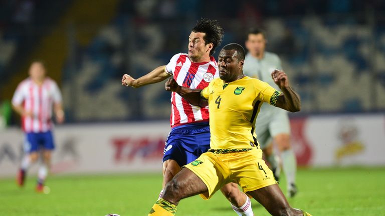 Paraguay's forward Nelson Valdez and Jamaica's defender Wesley Morgan vie during their 2015 Copa America football championship match