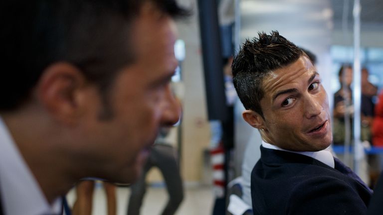 MADRID, SPAIN - SEPTEMBER 15:  Crsitiano Ronaldo (R) speaks with his agent Jorge Mendes (R) after his signing contract renewal For Real Madrid at Estadio S