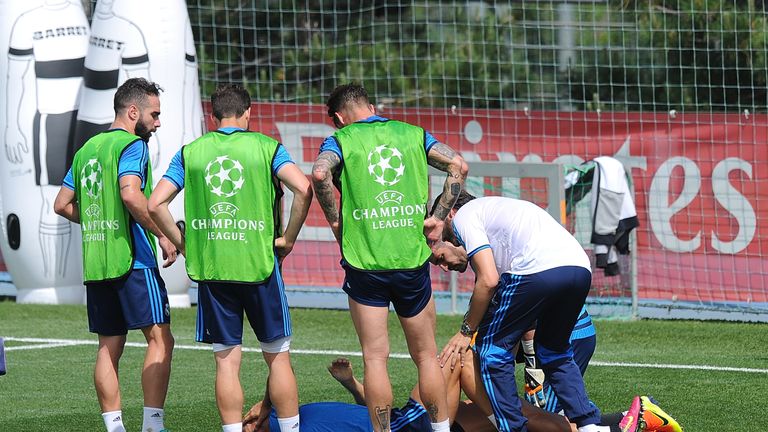 Cristiano Ronaldo of Real Madrid reacts after getting injured in the team training session during the Real Madrid Open Media Day