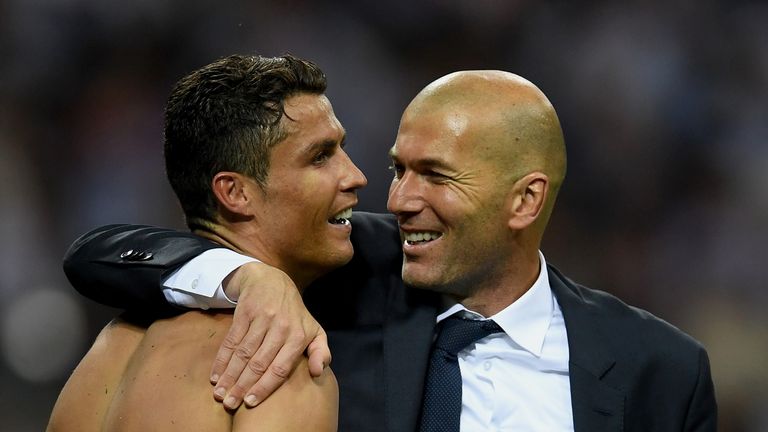 Real Madrid head coach Zinedine Zidane hugs a smiling Cristiano Ronaldo of Real Madrid after his match-winning penalty