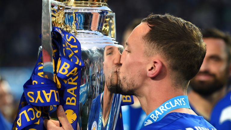 Danny Drinkwater of Leicester City kisses the Premier League trophy 