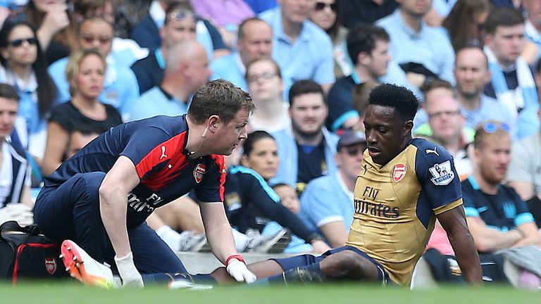 Arsenal's Danny Welbeck lays injured during the Barclays Premier League match at the Etihad Stadium, Manchester.
