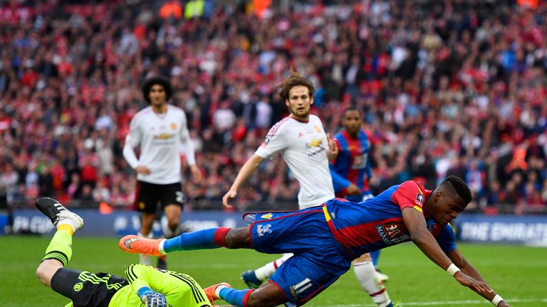 LONDON, ENGLAND - MAY 21:  David De Gea of Manchester United foils Wilfried Zaha of Crystal Palace during The Emirates FA Cup Final match between Mancheste