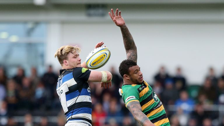 NORTHAMPTON, ENGLAND - APRIL 30:  David Denton (L) of Bath beats Courtney Lawes to the lineout ball during the Aviva Premiership match between Northampton 