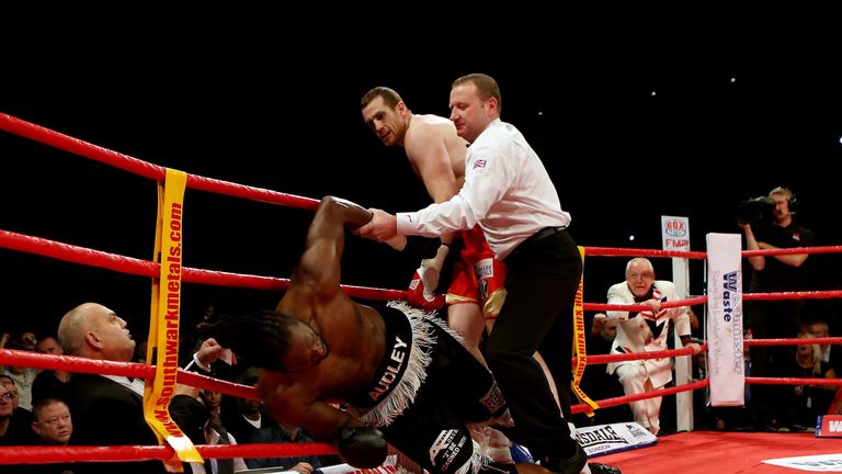 LIVERPOOL, ENGLAND - OCTOBER 13:  David Price knocks down Audley Harrison during their British and Commonwealth Heavyweight Championship fight on October 1