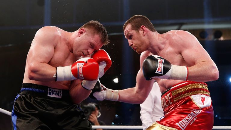 Yaroslav Zavorotnyi of Ukraine and David Price of Great Britain exchange punches during their heavyweight fight at Sport- und Kongresshalle