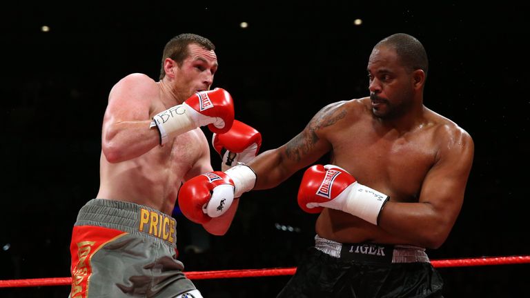 Tony Thompson of USA throws a right hand at David Price of Great Britain during the International Heavyweight Fight betw