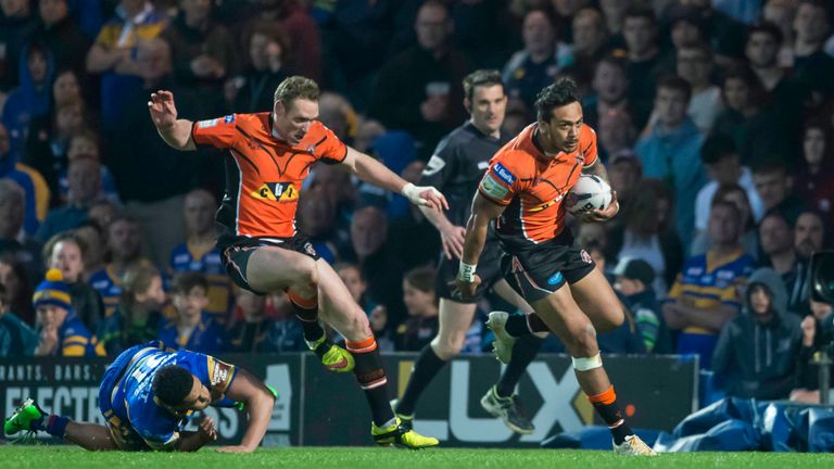 Castleford's Denny Solomona supported by Joel Monaghan cuts through the Leeds defence.