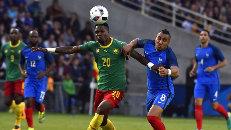 Cameroon midfielder Georges Mandjeck (L) fights for the ball with Payet