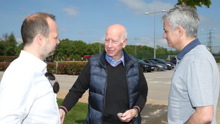 Jose Mourinho, new manager of Manchester United, is shown round the Aon Training Complex by Sir Bobby Charlton (centre) and Ed Woodward (left)