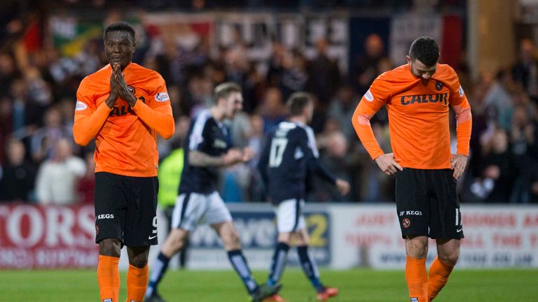Dejection for Dundee United's Edward Ofere and Mark Durnan after relegation