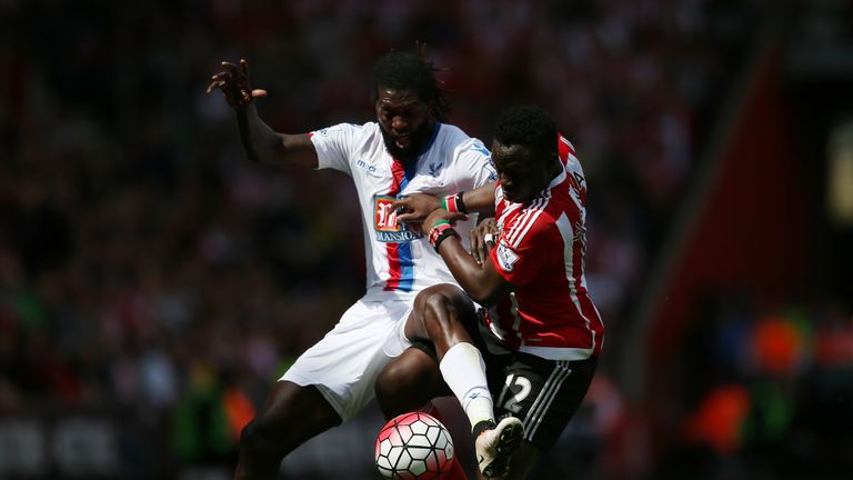 Emmanuel Adebayor of Crystal Palace tries to hold off Southampton's Victor Wanyama 