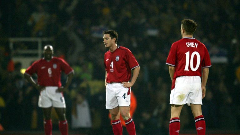 FEBRUARY 2003:  Sol Campbell , Frank Lampard and Michael Owen of England look dejected after Tony Popovic of Australia scores their first at Upton Park
