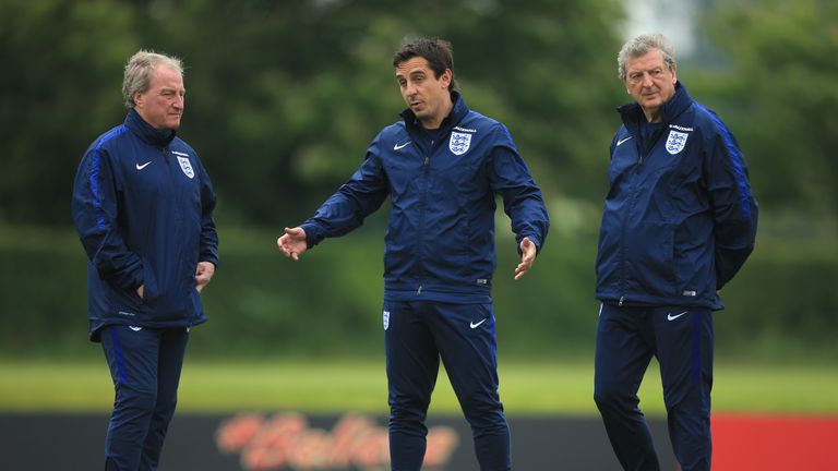 Manager of England, Roy Hodgson, Assistant Manager of England, Gary Neville and Ray Lewington look on during an England training session