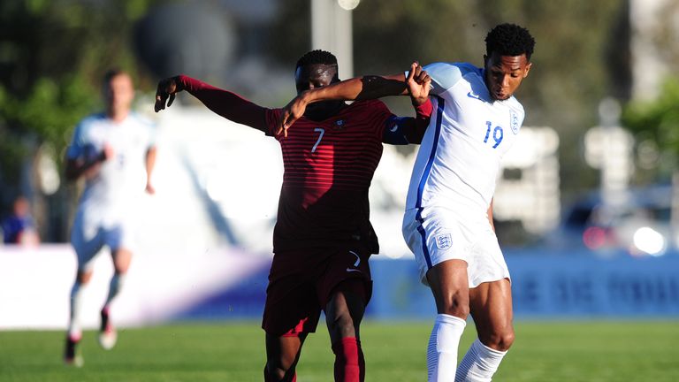 England's Kasey Palmer (right) is tackled by Romario Balde of Portugal