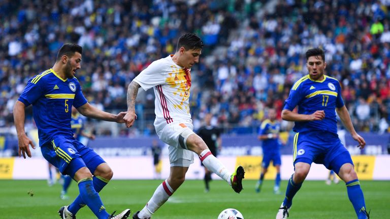 Hector Bellerin (centre) of Spain competes for the ball with Sead Kolasinac (L) and Ervin Zukanovic of Bosnia-Herzegovina