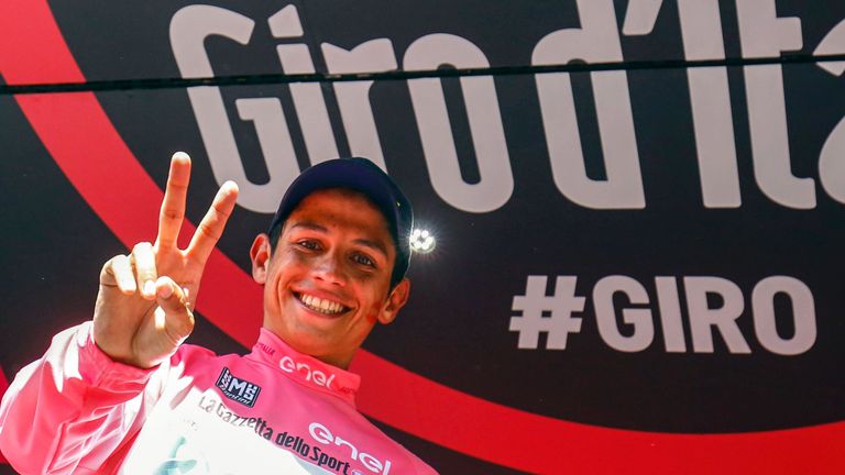 Colombian cyclist Esteban Chaves of Orica GreenEDGE team celebrates the pink jersey of the 