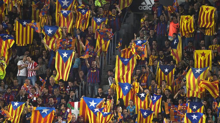 Supporters of Barcelona wave Catalan independentist flags "Estelada" as one also displays a Basque flag prior to the Spanish Copa del Rey (King's Cup) fina