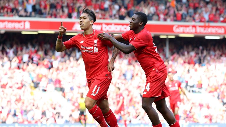 LIVERPOOL, ENGLAND - MAY 08:  Roberto Firmino of Liverpool (L) celebrates after scoring his side's second 