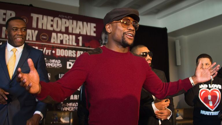 Floyd Mayweather (C) speaks during a press conference