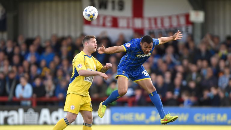 AFC Wimbledon's Darius Charles (right) and Accrington Stanley's Billy Kee battle for the ball