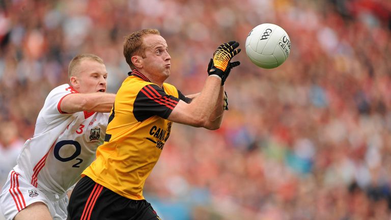 Down forward Benny Coulter is tackled by Michael Shields of Cork during the 2010 All-Ireland final