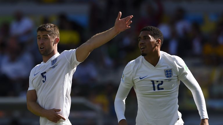 England's defender Gary Cahill (L) gestures alongside England's defender Chris Smalling