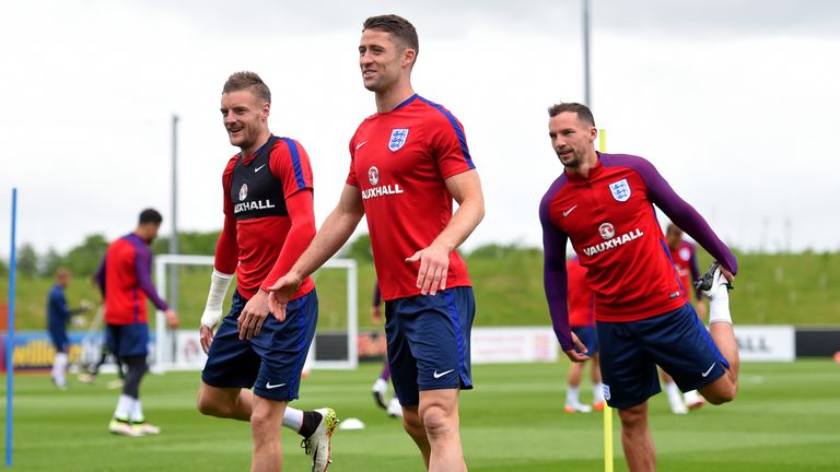 Gary Cahill (C) trains with England team-mates Jamie Vardy (L) and Danny Drinkwater (R) 