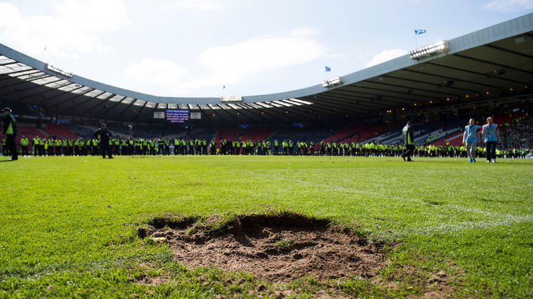 A general view of the Hampden pitch at full-time after a fan invasion by Hibernian fans 