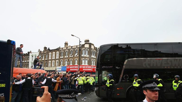 The Manchester United team coach attempts to make its way through the crowds prior to the Barclays Premier League match between West Ham