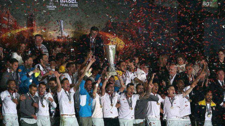 Sevilla lift the Europa League trophy in Basel.