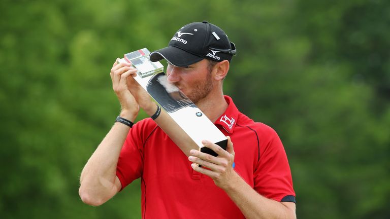 Chris Wood of England kisses the trophy following his victory during day four of the BMW PGA Championship at Wentworth