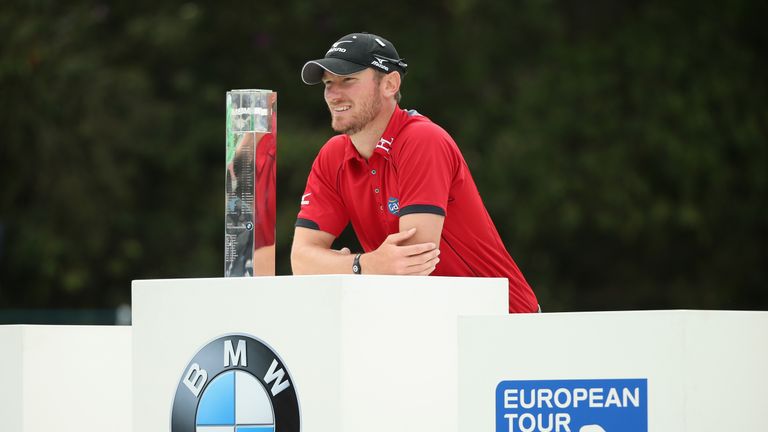 Chris Wood of England poses with the trophy following his victory during day four of the BMW PGA Championship at Wentworth