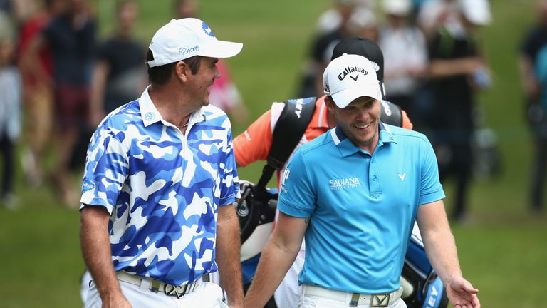 Scott Hend of Australia and Danny Willett of England chat during day three of the BMW PGA Championship at Wentworth