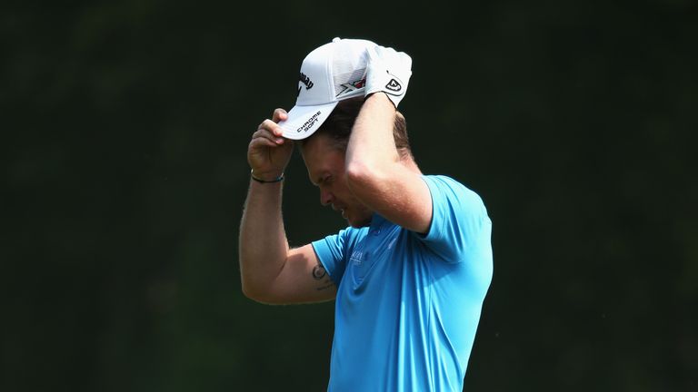 Danny Willett of England reacts to his 2nd shot on the 9th hole during day three of the BMW PGA Championship at Wentworth