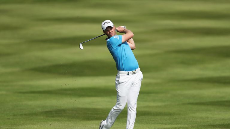 Danny Willett of England hits his 2nd shot on the 12th hole during day three of the BMW PGA Championship at Wentworth