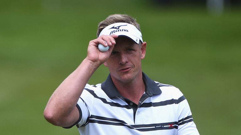 Luke Donald of England acknowledges the crowd on the 18th green during day one of the BMW PGA Championship at Wentworth 