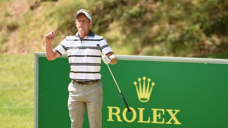 Luke Donald of England checks his line on the 13th hole during day one of the BMW PGA Championship at Wentworth