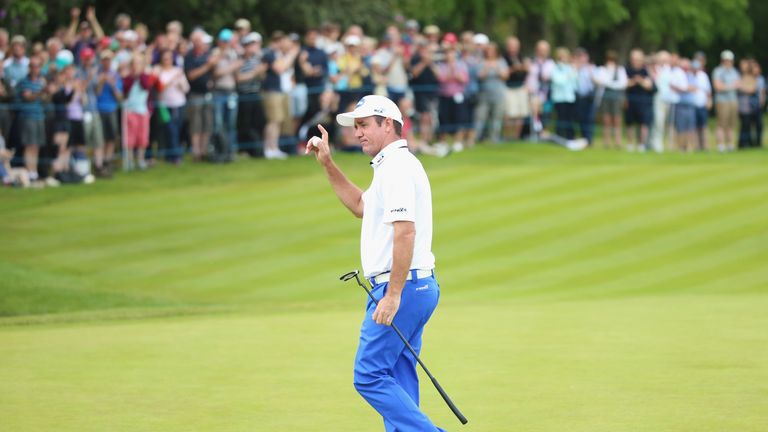 Scott Hend of Australia acknowledges the crowd on the 18th green during day two of the BMW PGA Championship at Wentworth 