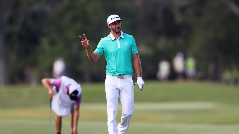 Dustin Johnson of the United States reacts to his eagle on the 12th hole during the second round of THE PLAYERS Championship at TPC Sawgrass
