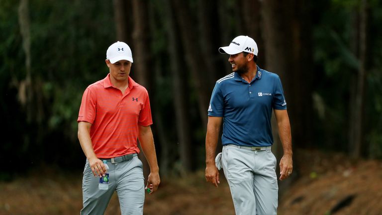 Jordan Spieth of the United States (L) and Jason Day of Australia walk together up the tenth fairway during the second round of The Players Championship